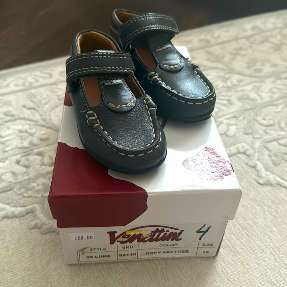 Grey leather moccasins